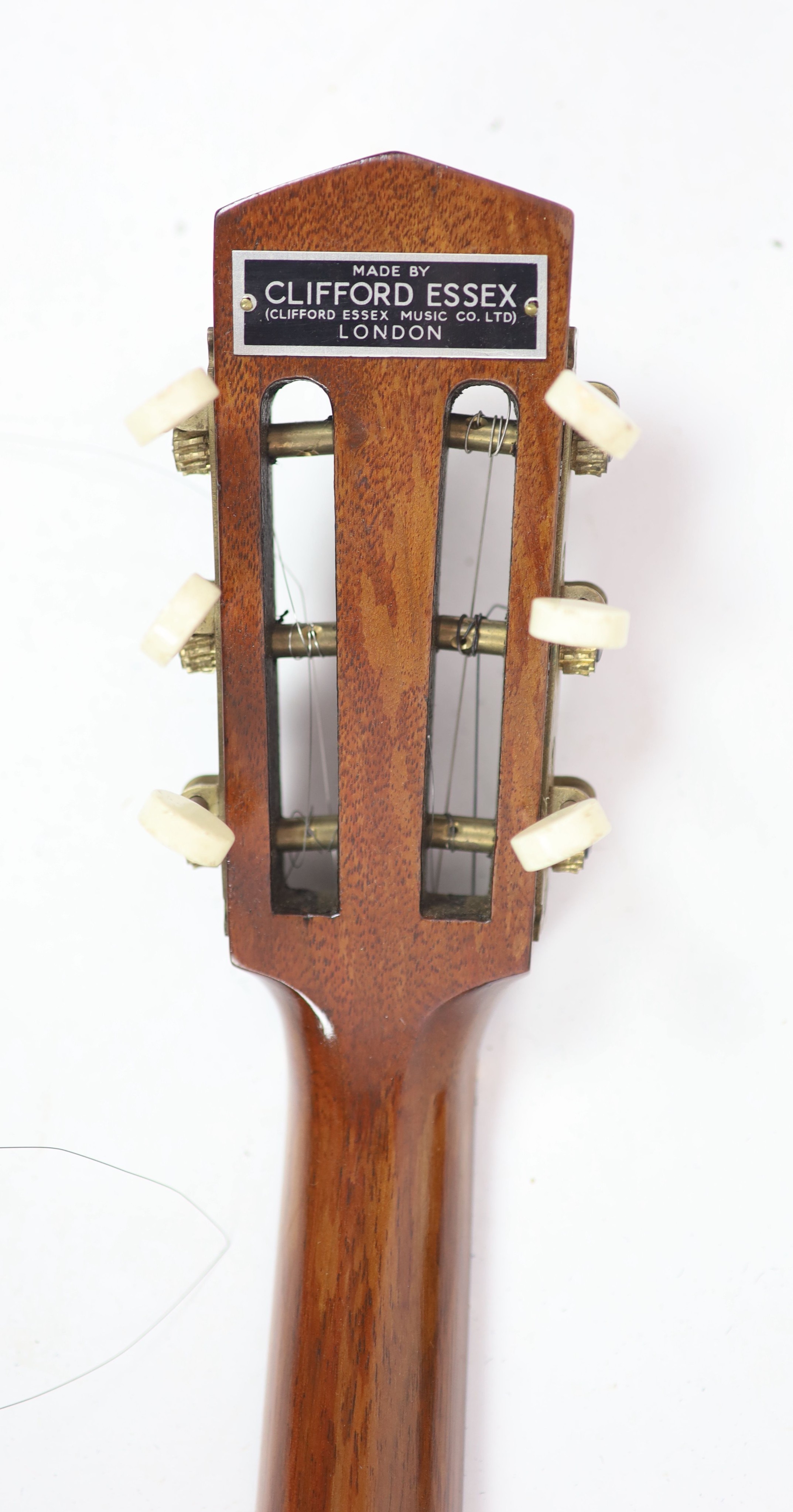 A Clifford Essex inlaid ebony banjo, overall length 94cm, with distressed leather case